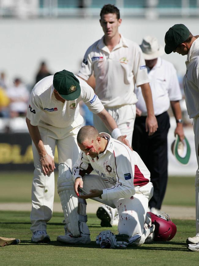 Shaun Tait (background) looks on after striking Northants batsman Tim Roberts during the 2005 Ashes tour. Picture: News Corp