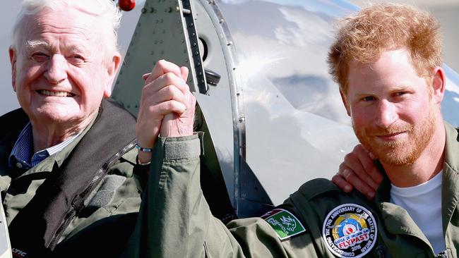 CHICHESTER, ENGLAND - SEPTEMBER 15: Prince Harry poses next to 95 year old Battle of Britain Veteran Tom Neil after he landed back at Goodwood Aerodrome in his Spitfire after a Battle of Britain Flypast on September 15, 2015 in Chichester, England. The 75th Anniversary of the Battle of Britain is being marked by a historic flypast that brings more Battle of Britain aircraft together than ever before as a show of thanks to 'the few' and the sacrifices they made. (Photo by Chris Jackson/Getty Images)