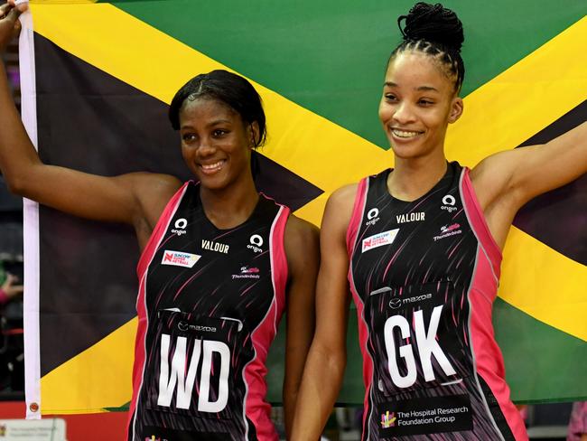 ADELAIDE, AUSTRALIA - APRIL 30: (L-R) Latanya Wilson of the Adelaide Thunderbirds (L) and Shamera Sterling of the Adelaide Thunderbirds with their country flag during during the round seven Super Netball match between Adelaide Thunderbirds and Collingwood Magpies at Netball SA Stadium, on April 30, 2023, in Adelaide, Australia. (Photo by Sue McKay/Getty Images)