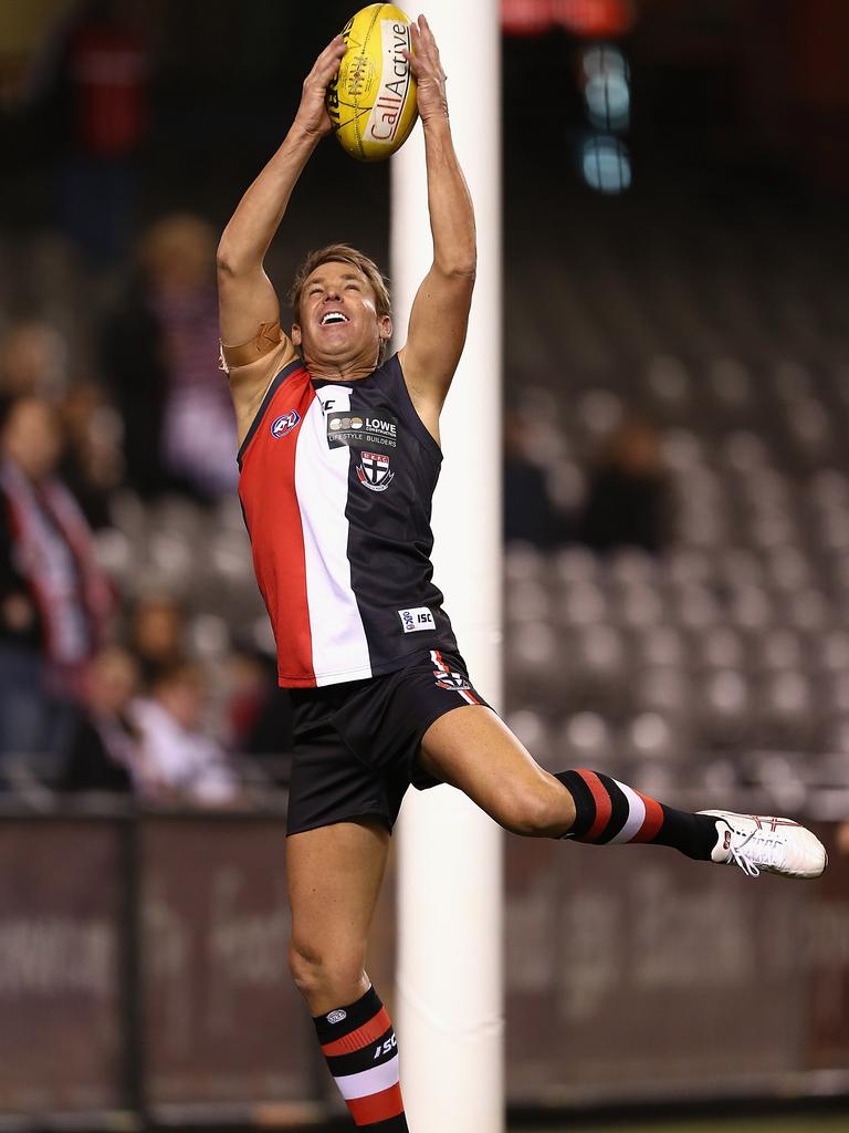 Shane Warne marks during the St Kilda Thank You Round charity match at Etihad Stadium on August 25, 2012 in Melbourne. Picture: Getty Images