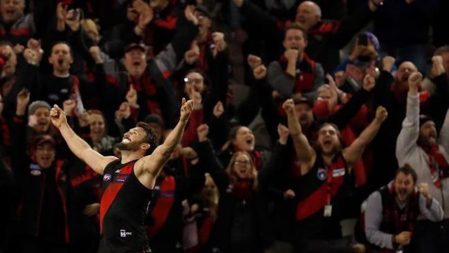 Essendon fans celebrate a Cale Hooker goal. Picture: AFL photos