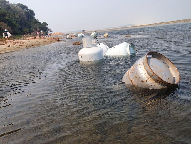 Gas bottles float in the river at Mallacoota after campers were reputedly told to put them in the water as fire approached. Picture: Supplied