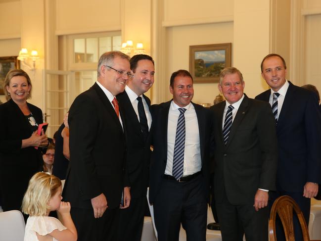 Ms Ley (left) watches as a group photo is taken of Mr Morrison, Steven Ciobo, Josh Frydenberg, Ian Macfarlane and Peter Dutton before the Governor-General Sir Peter Cosgrove swearing-in Ministers and Parliamentary Secretaries for the Abbott Government in 2014.