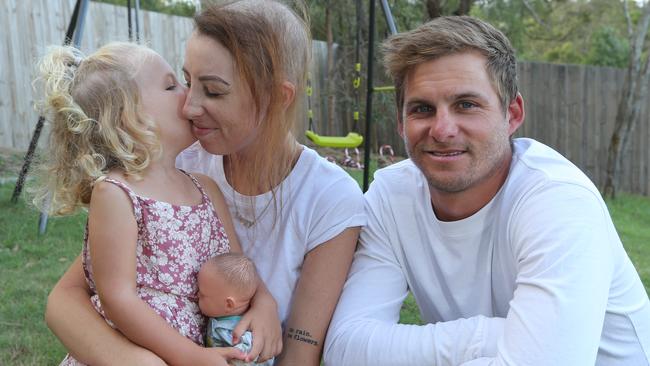 Pictured at their Upper Coomera home, Megy Gough and her husband Justin Gough and their 3-year-old daughter Harper. Pic Mike Batterham