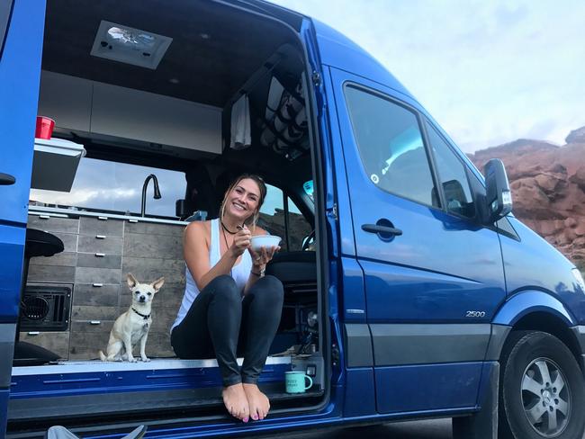 ONE TIME WEB USE ONLY - FEE APPLIES FOR REUSE -  Jess with her dog, Vinny. MEET the married couple who packed their life into a van and hit the road before their first wedding anniversary and plan to complete all 49 US states by next summer. Mike (34) and Jessica (33) Shisler, from Baltimore, Maryland, USA, were backpacking in Grand Teton National Park when they noticed a converted Sprinter van for sale on the side of the road. Despite being out of their price range a seed had been planted in their minds and two months later they bought their own 2013 Mercedes Sprinter to convert themselves, at a cost of $15,000 over five months. The adventurous couple are currently in south Florida, having driven 18,000 miles through 38 US states and part of Canada. They aim to complete all 49 states by next summer after a trip to Alaska. @van.there / mediadrumworld.com  Picture: Media Drum World/australscope