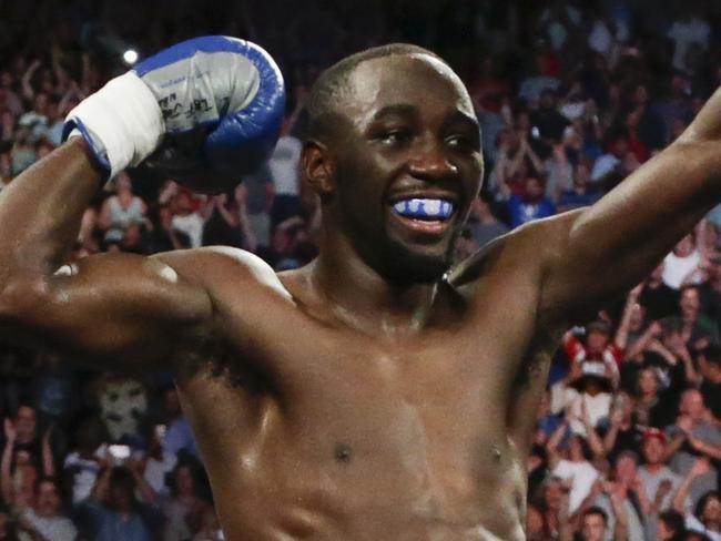 FILE - In this Aug. 19, 2017, file photo, Terence Crawford celebrates his victory by knockout over Julius Indongo in the third round of a junior welterweight world title unification bout in Lincoln, Neb. Jeff Horn and Terence Crawford, both unbeaten, meet Saturday night, June 9, 2018, in Las Vegas for Horn's welterweight title in a fight that offers an intriguing matchup of brawler versus boxer in a division that is suddenly getting a lot of attention in boxing. (AP Photo/Nati Harnik, File)