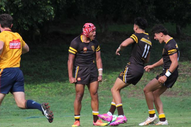 Harlem Faalafi celebrates his second try.