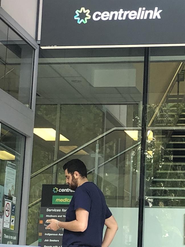 A local waits for his turn at Centrelink Bankstown. Picture: Lawrence Machado