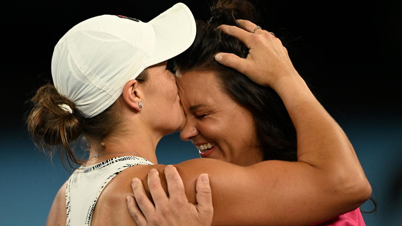 Australia's Ashleigh Barty kisses friend and doubles partner Casey Dellacqua