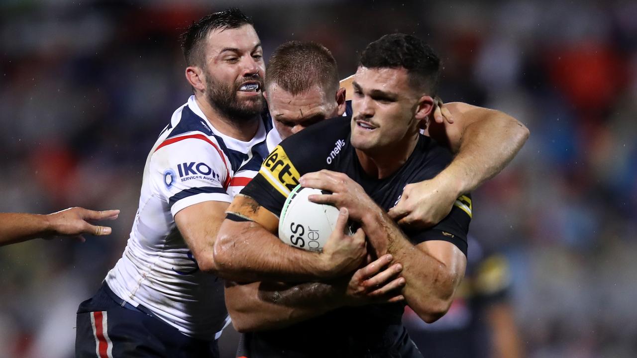 PENRITH, AUSTRALIA - JULY 01: Nathan Cleary of the Panthers is tackled by James Tedesco of the Roosters during the round 16 NRL match between the Penrith Panthers and the Sydney Roosters at BlueBet Stadium on July 01, 2022 in Penrith, Australia. (Photo by Jason McCawley/Getty Images)