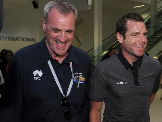 Race director Mike Turtur meets Cadel Evans at the airport.