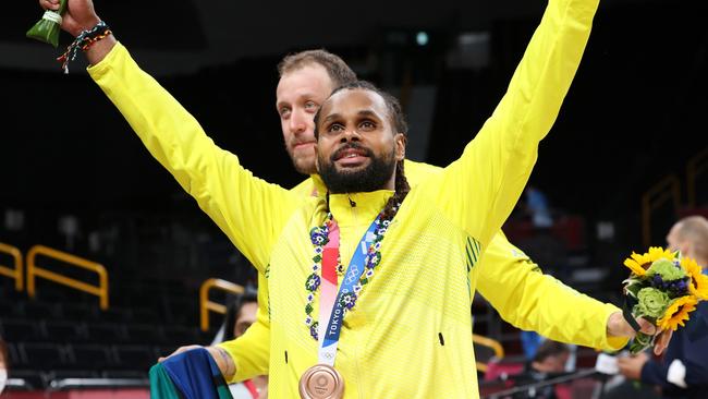 SAITAMA, JAPAN - AUGUST 07: Patty Mills of Team Australia celebrates with his bronze medal during the Men's Basketball medal ceremony on day fifteen of the Tokyo 2020 Olympic Games at Saitama Super Arena on August 07, 2021 in Saitama, Japan. (Photo by Kevin C. Cox/Getty Images)