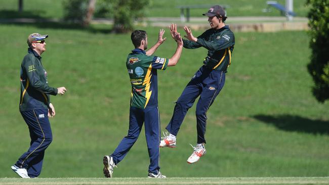 Thunder players celebrate a wicket.