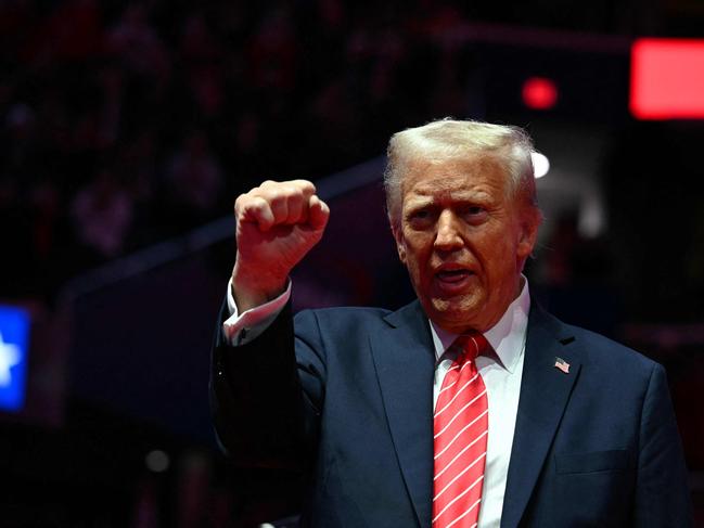 US President-elect Donald Trump reacts during a MAGA victory rally at Capital One Arena in Washington, DC, on January 19, 2025, one day ahead of his inauguration ceremony. (Photo by Jim WATSON / AFP)