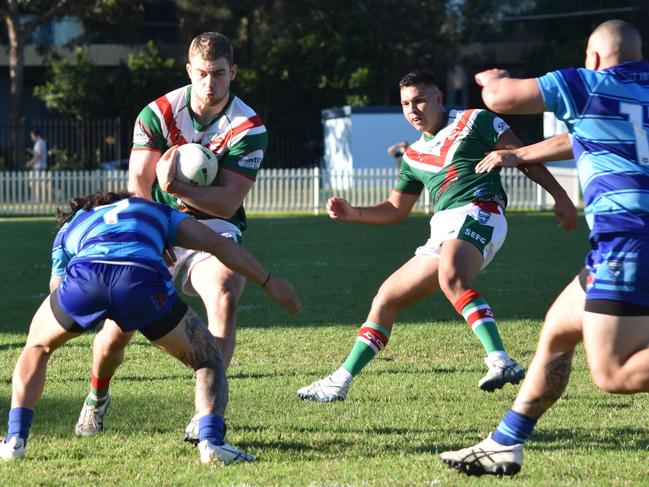 Taine Woodford is hit by Andrew Kapinga. Picture: Sean Teuma/NewsLocal