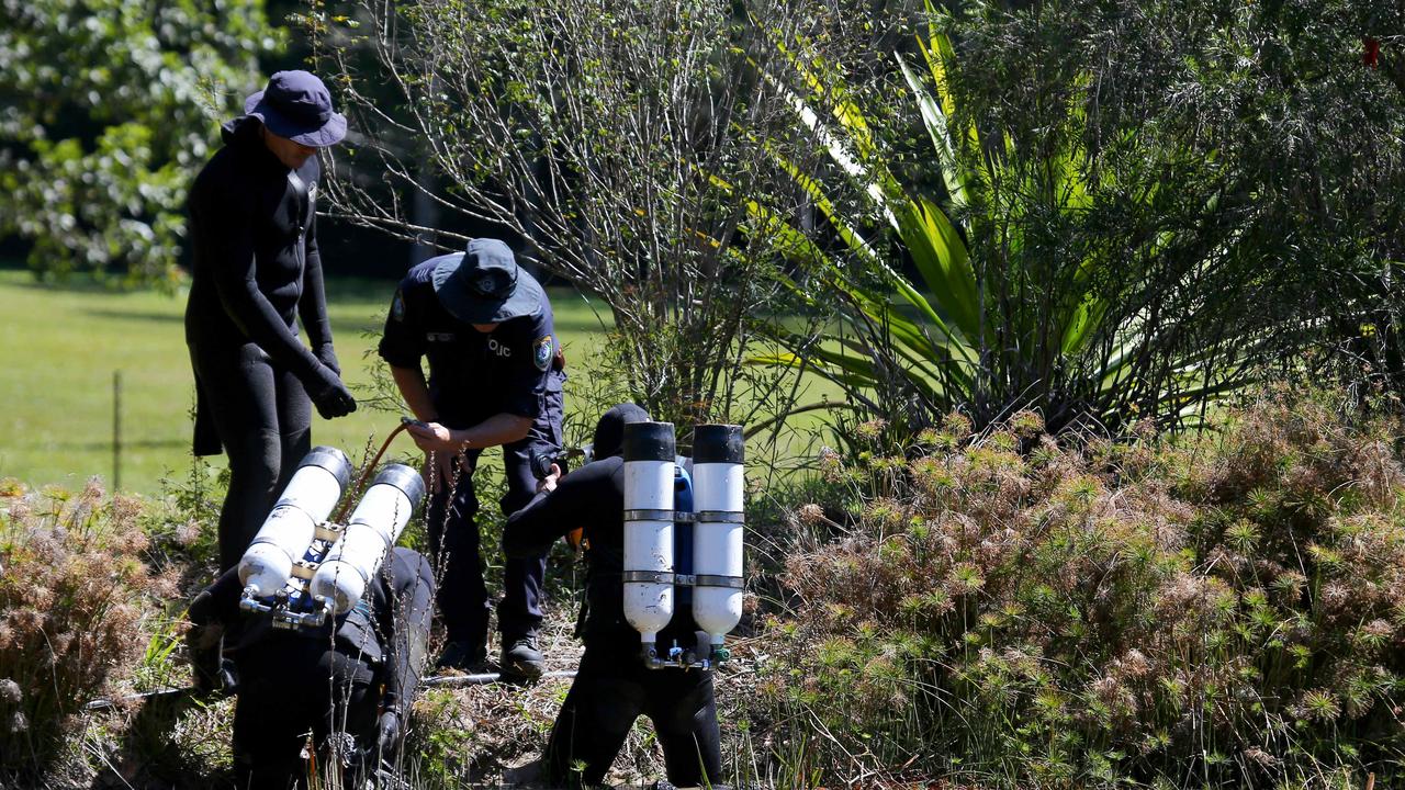 Police divers search a dam near the house in Kendall during the search. Picture: Nathan Edwards