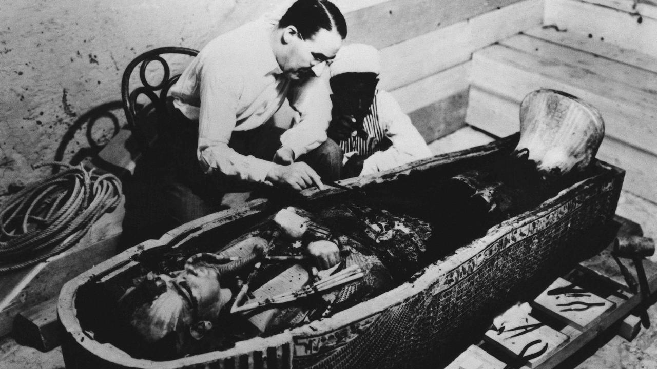 Howard Carter examines King Tut's sarcophagus. Picture: AP