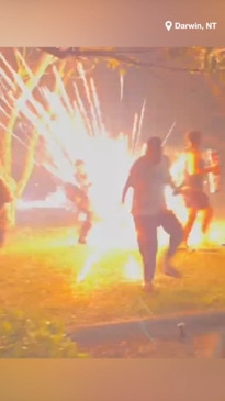 Wild moment Territory Day partygoers are bombarded by fireworks