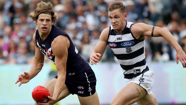 Nat Fyfe gets away from Joel Selwood, as he’s getting away from the rest of the Brownlow hopefuls. Picture: Colleen Petch.