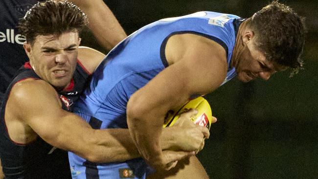 Sturt’s Tom Lewis is tackled by Norwood’s Nik Rokahr at The Parade. Picture: Matt Loxton.