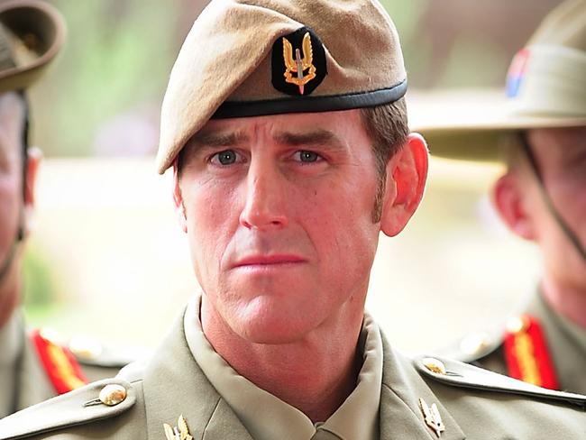 Australian Army soldier Corporal Benjamin Roberts-Smith, VC, MG, takes a seat after being awarded the Victoria Cross for Australia during the investiture ceremony in Perth on 23 January 2011. *** Local Caption *** The Governor-General of the Commonwealth of Australia held an investiture ceremony at Campbell Barracks in Perth to award a Victoria Cross for Australia to Corporal Benjamin Roberts-Smith, VC, MG, on 23 January 2011.  Corporal Benjamin Roberts-Smith, VC, MG, from the Special Air Service Regiment was awarded the Victoria Cross for Australia for his gallantry under fire during operations in Afghanistan in June 2010.    Present at the ceremony were the Governor-General of the Commonwealth of Australia, Her Excellency Ms Quentin Bryce AC; Prime Minister of Australia the Hon. Julia Gillard MP; Leader of the Opposition the Hon. Tony Abbott MP; Minister for Defence the Hon. Stephen Smith MP; Minister for Defence Science and Personnel the Hon Warren Snowdon MP; Governor of Western Australia, His Excellency Dr Ken Michael AC; Premier of Western Australia the Hon. Colin Barnett MLA; Ambassador of the Islamic Republic of Afghanistan, his Excellency Dr Amanullah Jayhoon; Member for Curtin the Hon. Julie Bishop MP; Chief of the Defence Force, Air Chief Marshal Angus Houston AC AFC; Chief of Army, Lieutenant General Ken Gillespie AO DSC CSM; and Special Operations Commander Australia, Major General Gus Gilmore DSC.  The Victoria Cross for Australia is our highest honour. It is only awarded to those who display the most conspicuous gallantry and daring in the face of the enemy. Corporal Benjamin Roberts-Smith, VC, MG, becomes the 98th Australian recipient of the award and the second recipient of the Victoria Cross for Australia since it was instituted in 1991. Picture: Department of Defence