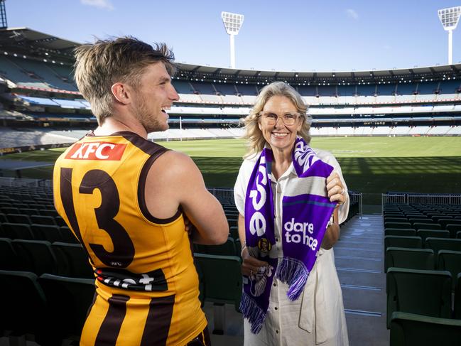 Dylan Moore shows off the famous Hawks No. 13, worn by Cherie Dear’s husband Paul. Picture: Wayne Taylor