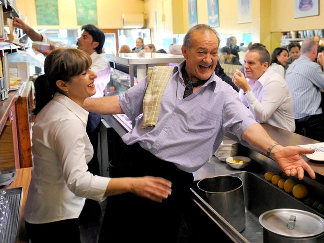 Sisto Malaspina enjoys a lighter moment with his staff in Pellegrini's Expresso Bar. Picture: William West/AFP