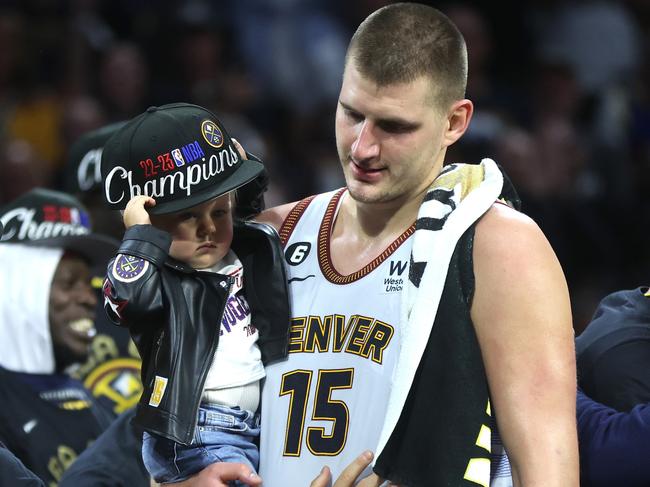 DENVER, COLORADO - JUNE 12: Nikola Jokic #15 of the Denver Nuggets celebrates with his daughter Ognjena after a 94-89 victory against the Miami Heat in Game Five of the 2023 NBA Finals to win the NBA Championship at Ball Arena on June 12, 2023 in Denver, Colorado. NOTE TO USER: User expressly acknowledges and agrees that, by downloading and or using this photograph, User is consenting to the terms and conditions of the Getty Images License Agreement. (Photo by Matthew Stockman/Getty Images)