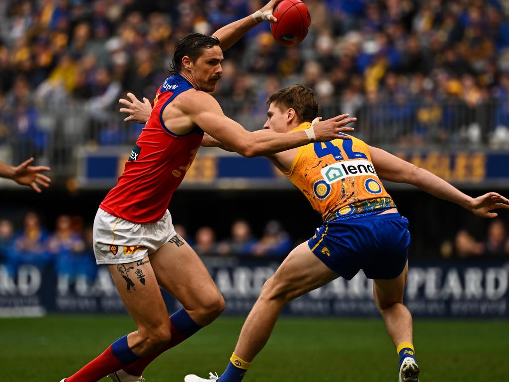 Joe Daniher tries to evade Harry Edwards. Picture: Daniel Carson/AFL Photos via Getty Images