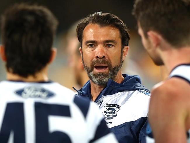 BRISBANE, AUSTRALIA - AUGUST 10: Cats coach Chris Scott talks to his team during the round 11 AFL match between the St Kilda Saints and the Geelong Cats at The Gabba on August 10, 2020 in Brisbane, Australia. (Photo by Jono Searle/AFL Photos/via Getty Images)