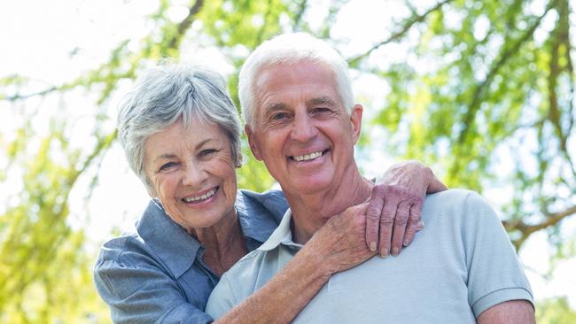 Quest Seniors Week - Alzheimers Australia.Happy old couple smiling in a park on a sunny day