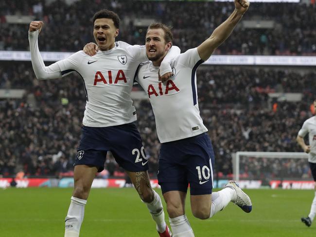 Tottenham Hotspur's Harry Kane celebrates scoring AGAINST Arsenal.