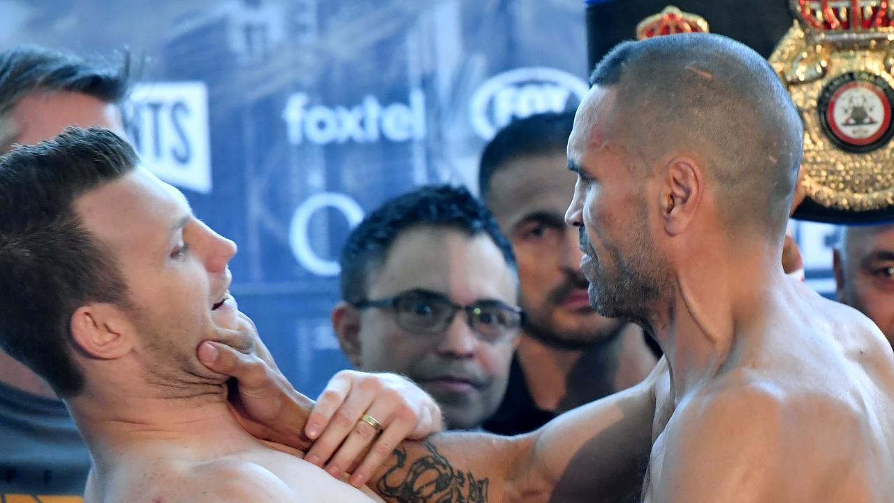 Anthony Mundine grabs Jeff Horn by the throat at the weigh-in.