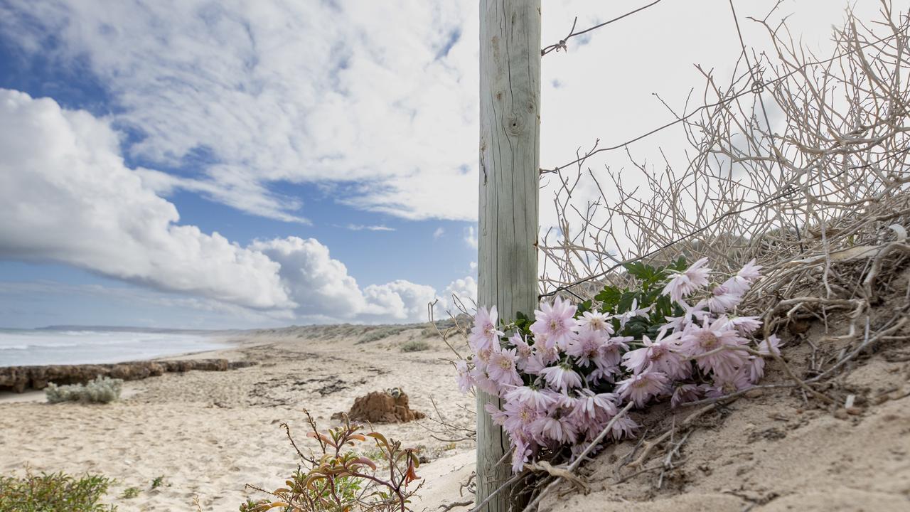 Floral tributes laid at Back Beach for the two women. Picture: Brett Hartwig
