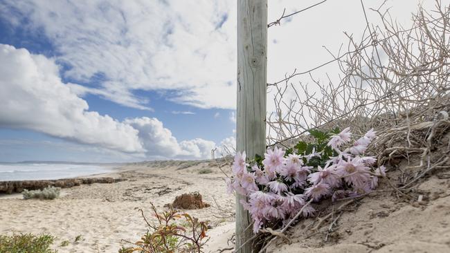 Floral tributes laid at Back Beach for the two women. Picture: Brett Hartwig