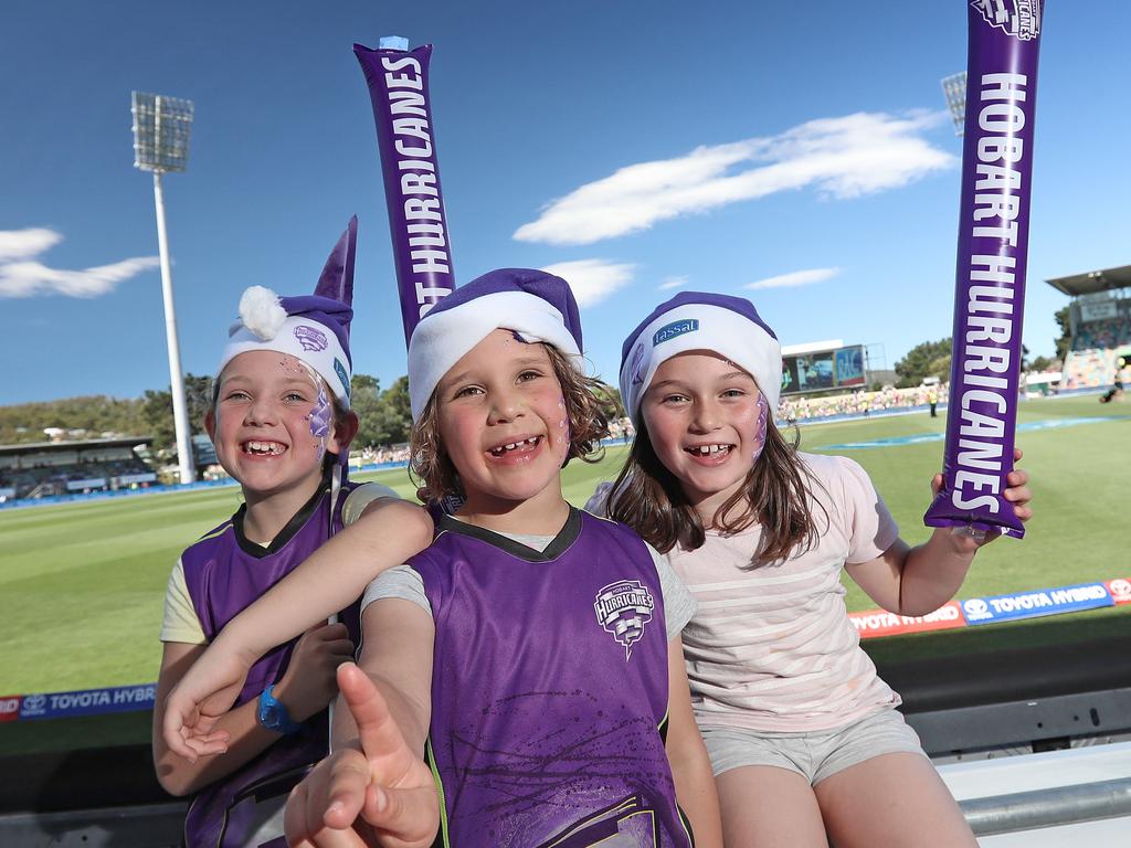 From left, sisters Ruby and Molly Dudman with friend Isabel Lancaster excited for the Hurricanes match against the Melbourne Stars on Christmas Eve. Picture: LUKE BOWDEN