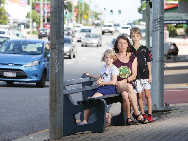 Ili Bone with children Evie, 8, and Jo Leonard, 9, on busy Ipswich Rd, Moorooka. Picture: Ric Frearson/AAP