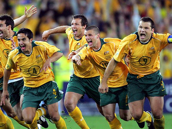 Socceroos players including captain Mark Viduka (2nd R) celebrate after Australia defeated Uruguay in 2006 FIFA World Cup Qualification 2nd leg match at Telstra Stadium, Olympic Park, Homebush, Sydney, 16/11/2005.