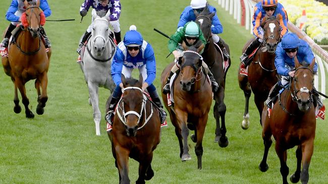 Winx wins her fourth Cox Plate with Bowman in 2018 to become the only horse to achieve the feat. Picture: Jay Town