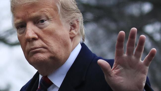 President Donald Trump walks on the South Lawn upon arrival at the White House in Washington, Saturday, Jan. 19, 2019, after attending the casualty return at Dover Air Force Base, Del., for the four Americans killed in a suicide bomb attack in Syria. (AP Photo/Manuel Balce Ceneta)