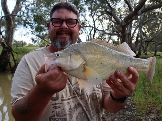 Wangaratta fisherman Robbie Alexander, 49, reeled in a replica handgun while fishing in the King River, Oxley, near Wangaratta in November 2024. Police have not been able to find the firearm's owner, or link it to any crimes. Picture: SUPPLIED