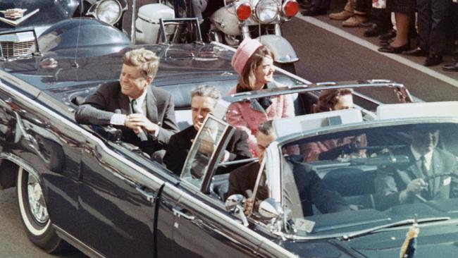 Moments before the assassination, John F Kennedy, his wife Jackie, the Texas governor John Connally and his wife, Nellie, on Main Street in Dallas.