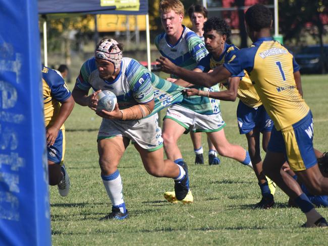 Gladstone Ringers’ prop Gavin Wilson-Tyers powers his way towards his third try in the under-17 grand final. Photo: Pam McKay