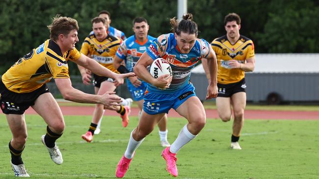 Pride's Tom Chester is chased by Thallon Peters after making a tackle break in the Hostplus Cup Queensland Rugby League (QRL) match between the Northern Pride and the Sunshine Coast Falcons, held at Barlow Park, Cairns Picture: Brendan Radke