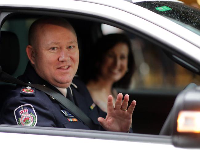 RFS Commissioner Shane Fitzsimmons and his wife Lisa leave the NSW headquarters on his last day. Picture: Christian Gilles