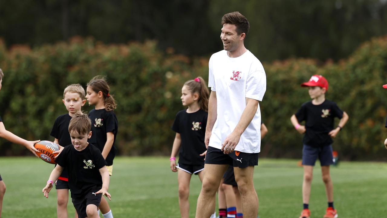 Toby Greene with participants of the 5th Quarter Camp. Photo by Phil Hillyard