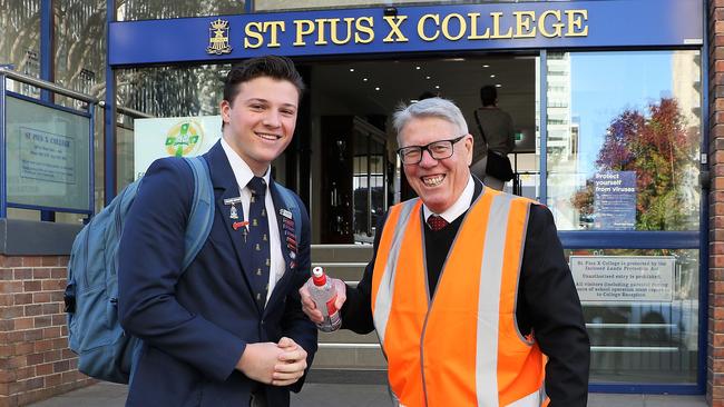 College Principal Mr John Couani greets students with hand sanitiser and the 'new rules' upon return to school Monday 11th May. Picture: Tracy Bradley