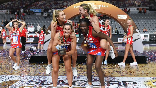 NSW Swifts players Helen Housby, Sophie Garbin, Nat Haythornthwaite and Sam Wallace celebrate after their victory during the 2021 Super Netball decider.