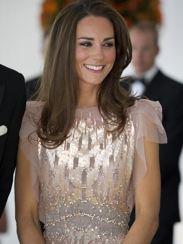 While Kate chose sparkles and princess style. Picture: AP Photo/Arthur Edwards, Pool