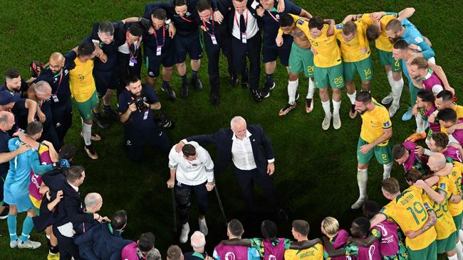 Graham Arnold and the Socceroos celebrate after their 1-0 defeat of Denmark to make the Round of 16 at the 2022 World Cup. (Photo by FranÃ§ois-Xavier MARIT / AFP)